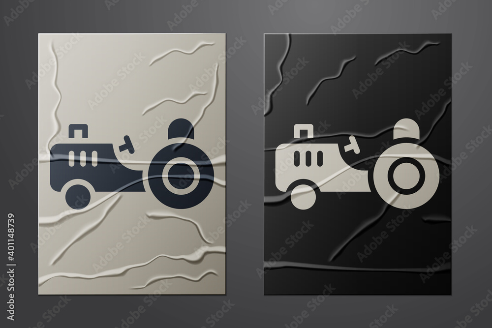 White Tractor icon isolated on crumpled paper background. Paper art style. Vector.