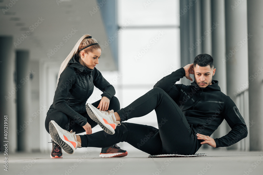 Lying down, doing exercises.