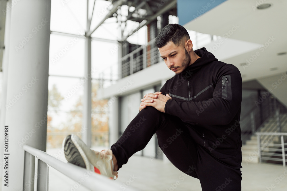 Active man doing exercises in his training studio.