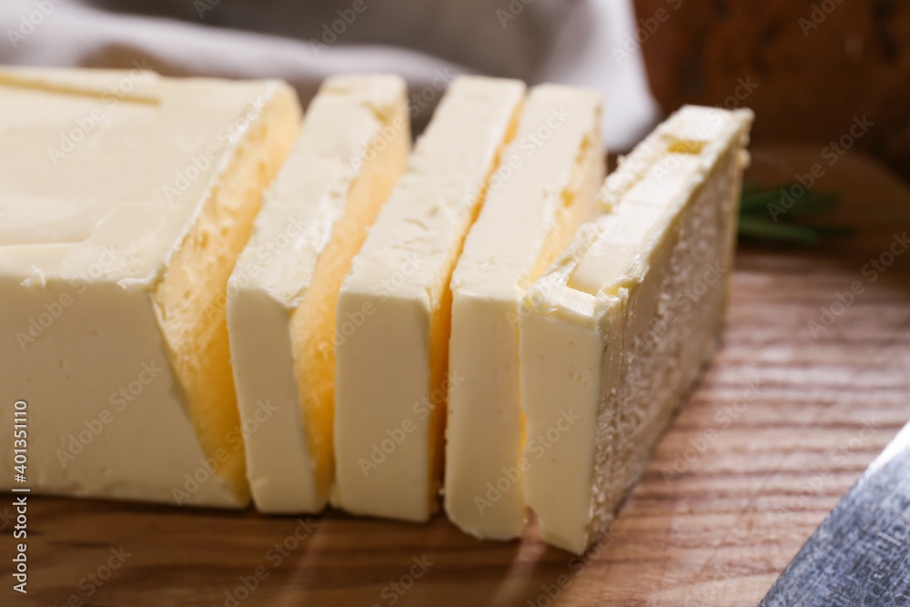 Chopping board with fresh butter, closeup