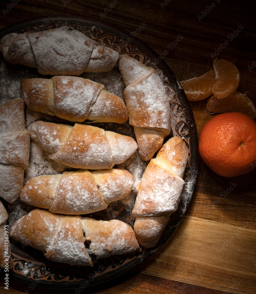 Sweet rolls filled with jam on the kitchen table