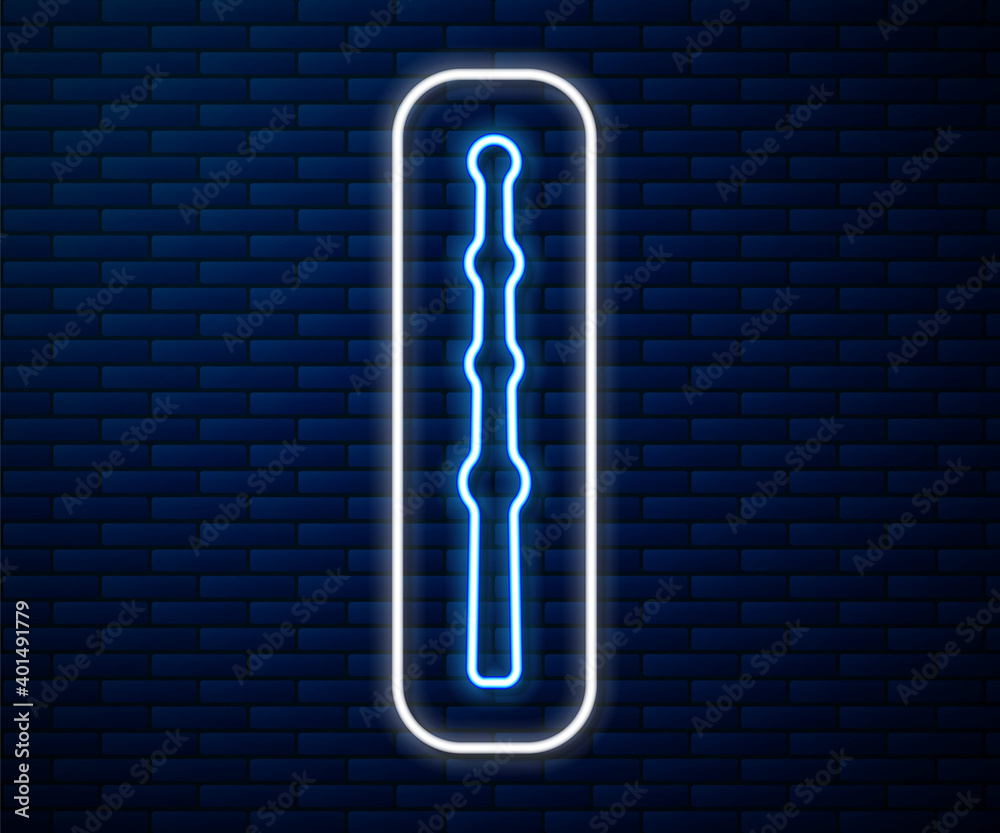 Glowing neon line Magic wand icon isolated on brick wall background. Star shape magic accessory. Mag