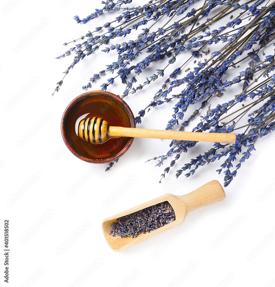 Lavender twigs and honey on white background