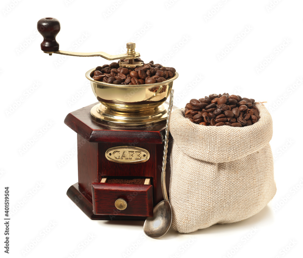 Bag with coffee beans and grinder on white background