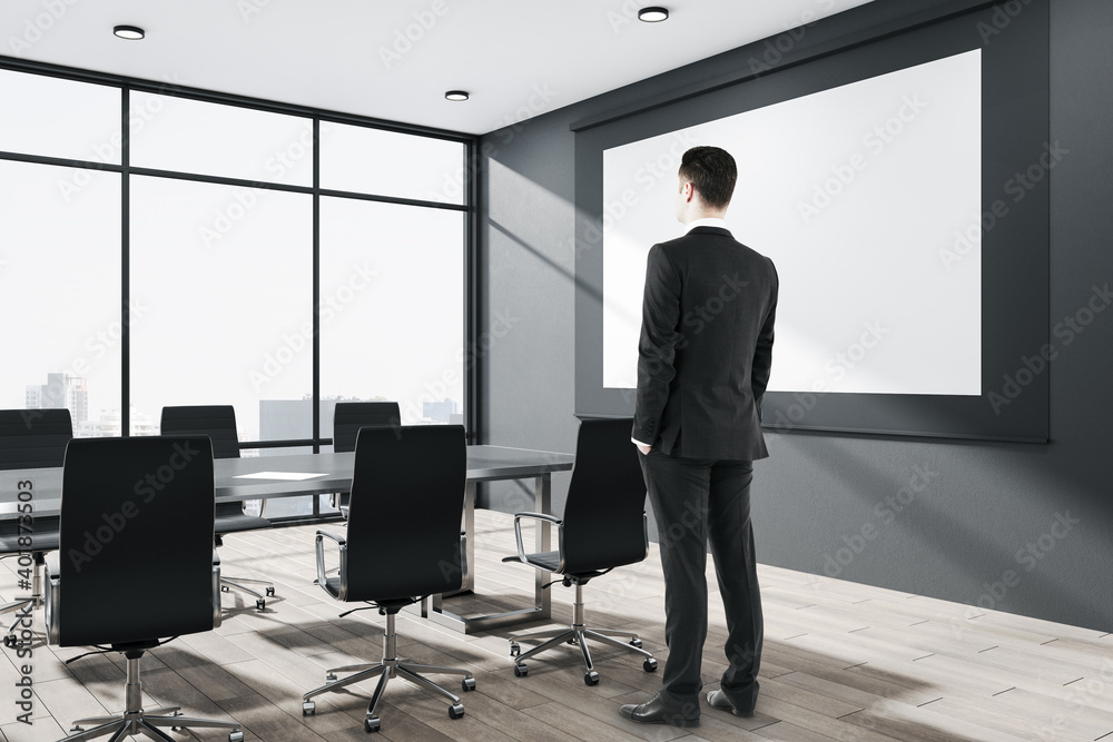 Businessman standing in conference room