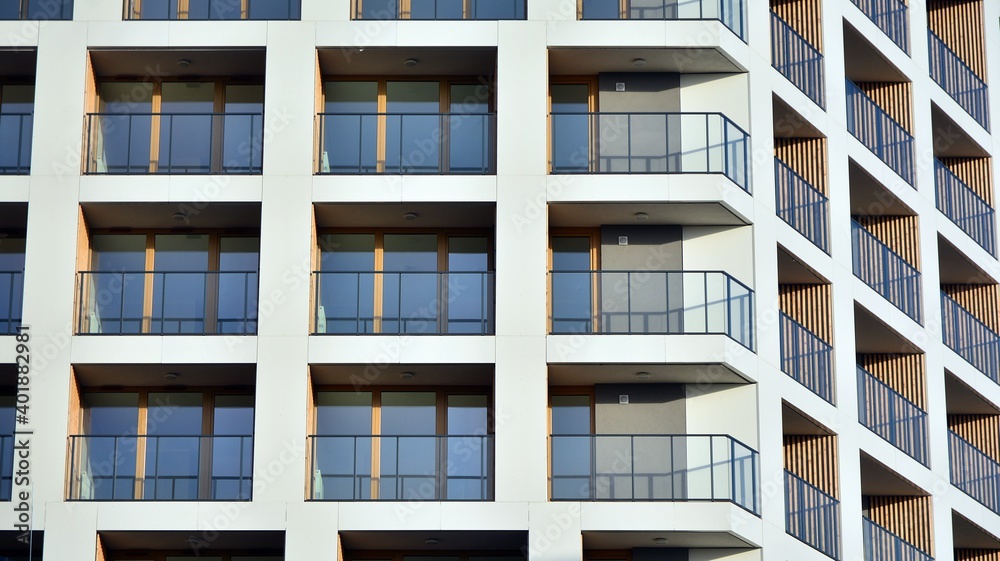 Facade of new apartment building. Glass balcony and clean look of modern architecture building with 