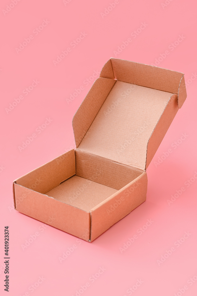 Blank cardboard box on color background