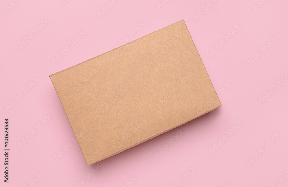 Blank cardboard box on color background