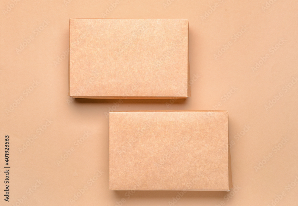 Blank cardboard boxes on color background