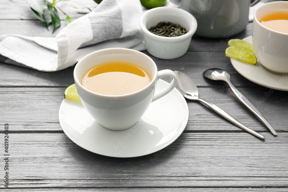 Cup of green tea on wooden table