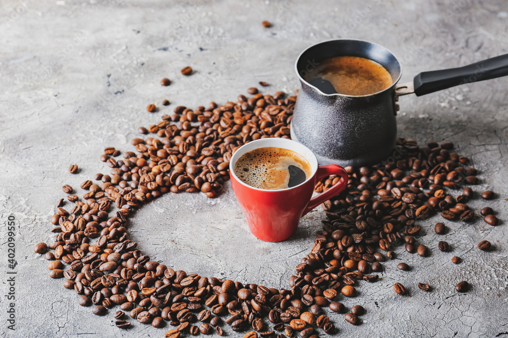 Heart shape made of coffee beans on table