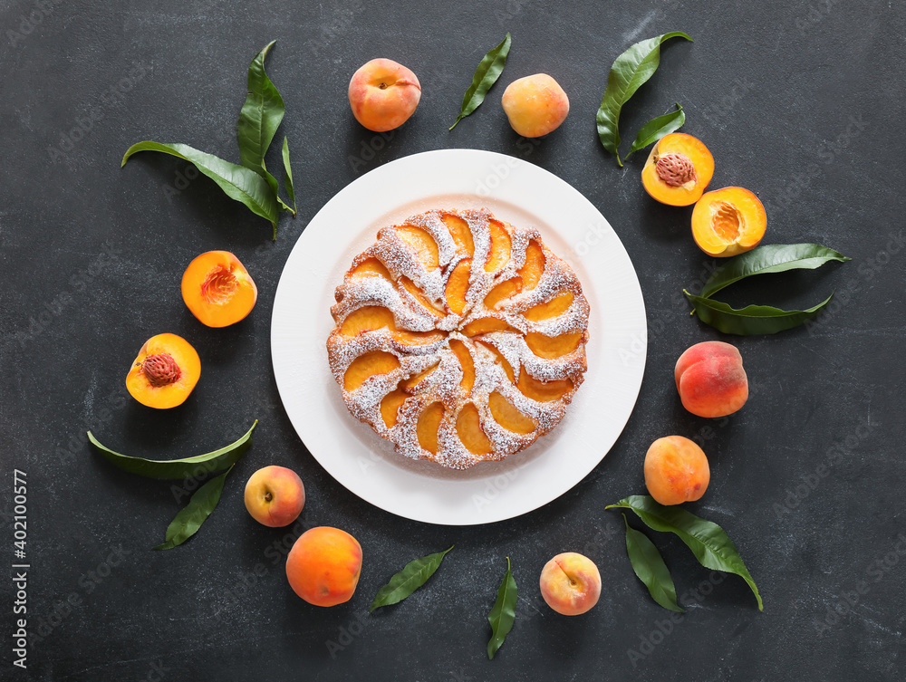 Composition with tasty peach pie on dark background