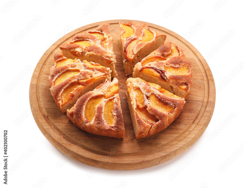 Board with tasty peach pie on white background