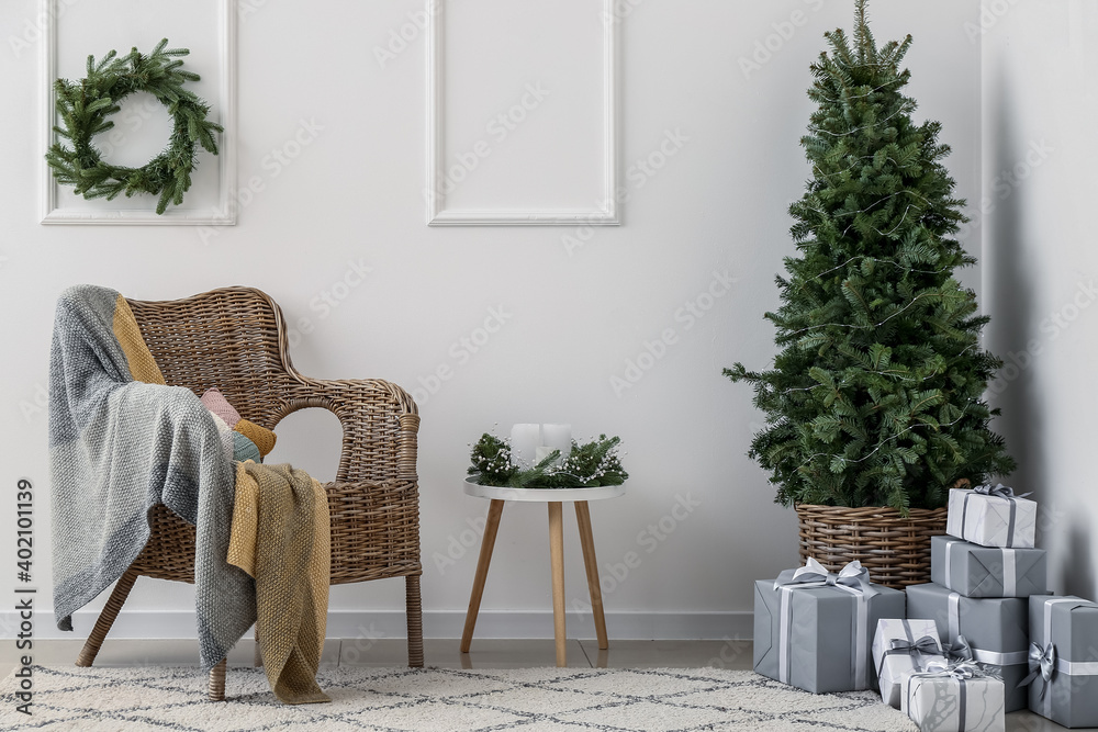 Interior of living room with beautiful Christmas tree and gift boxes