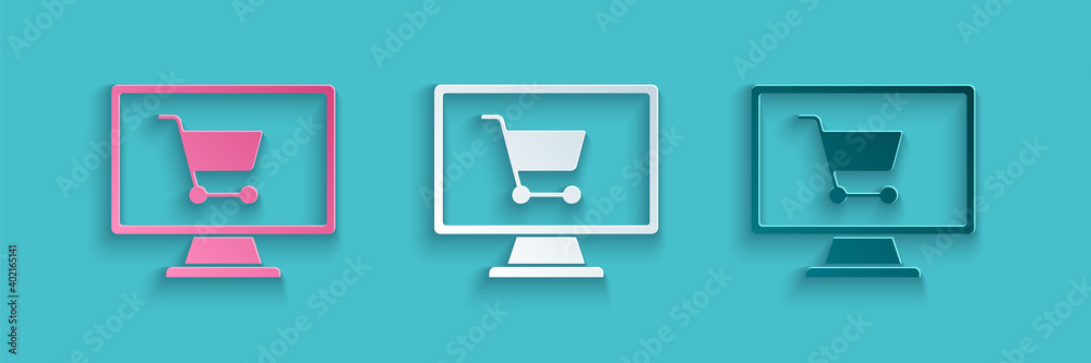 Paper cut Shopping cart on screen computer icon isolated on blue background. Concept e-commerce, e-b