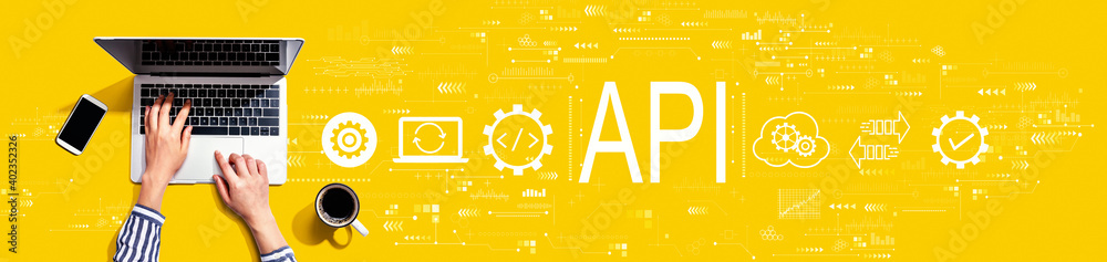 API - application programming interface concept with person using a laptop computer