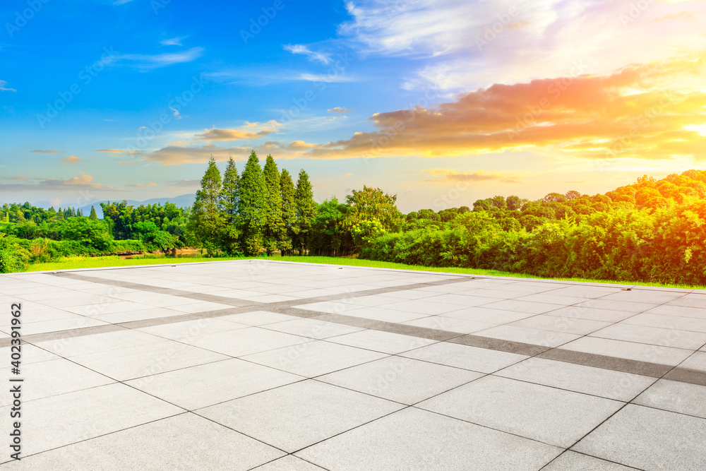 Empty square floor and green mountain background.