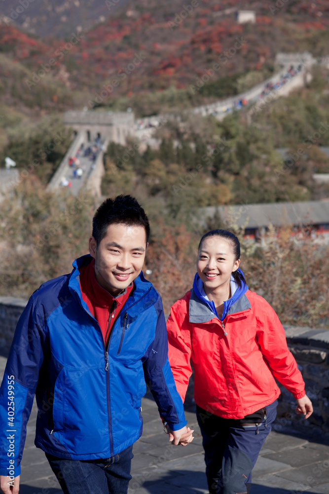 Young couples take pictures in the Great Wall Tourism