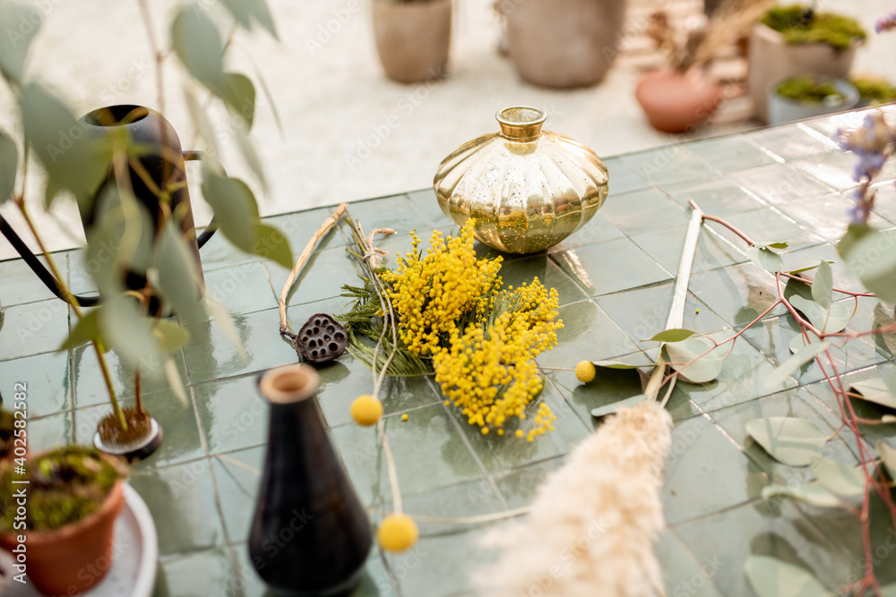 Herbs and flowers during a floral workshop on the table outdoors