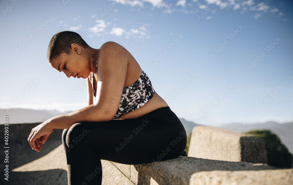 Woman relaxing after outdoor training session