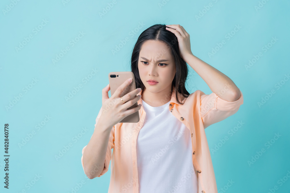 Beautiful Asian women disappointed faces When you look at the phone