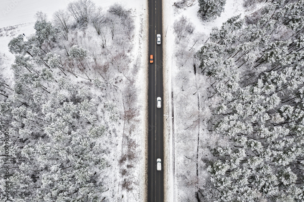 Aerial view of the road in idyllic winter landscape.