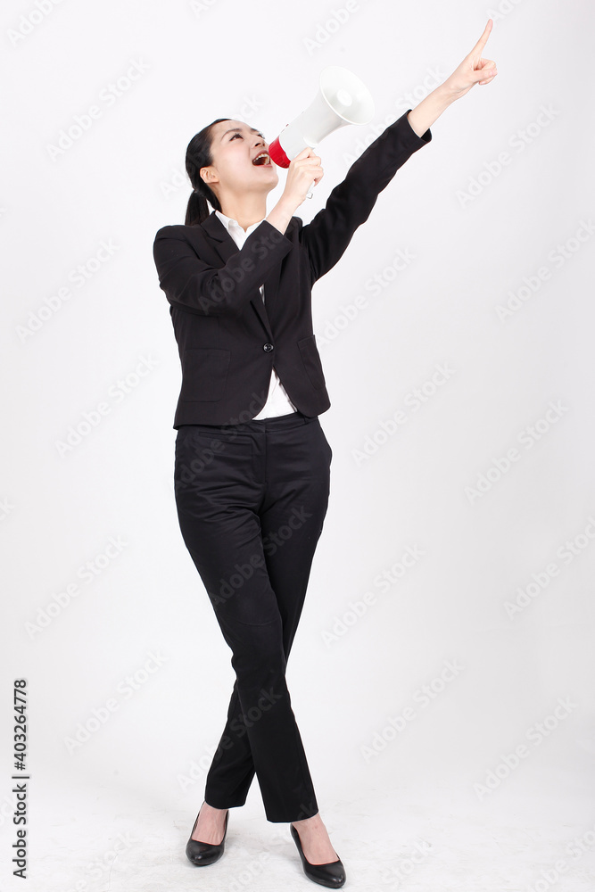 A young business woman holding a megaphone