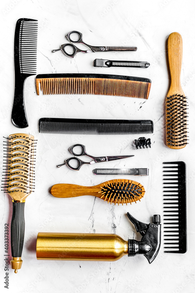 hairdressing concept with barber tools on white background top view