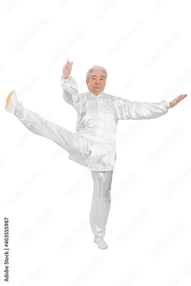 An old man is playing Tai Chi 