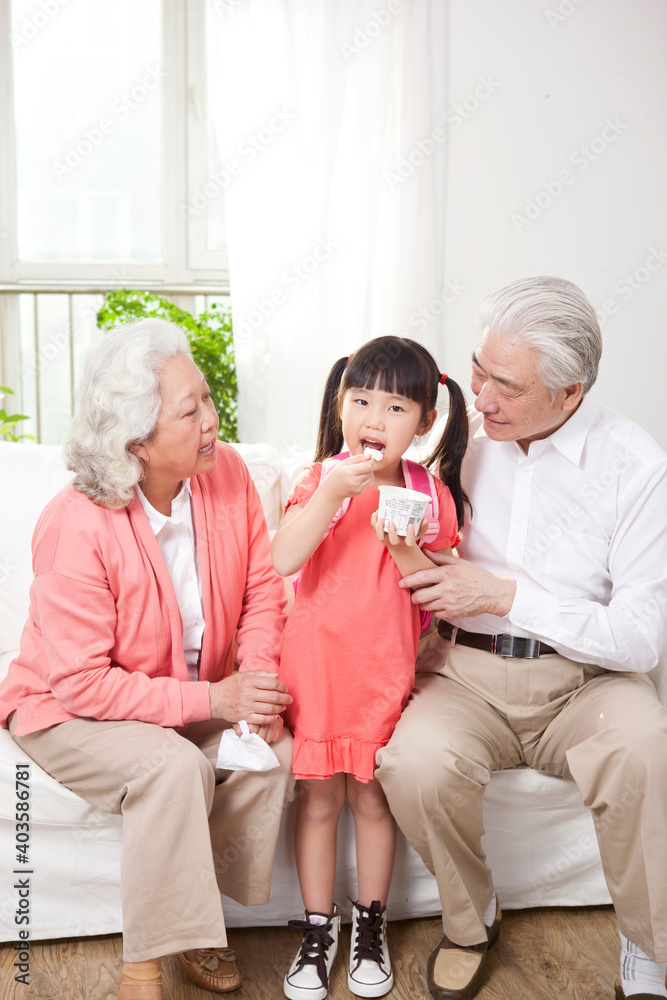 Happy grandparents and grandchildren are playing in the living room 