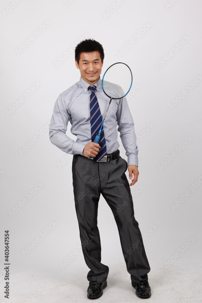 A business exercising with man playing badminton 