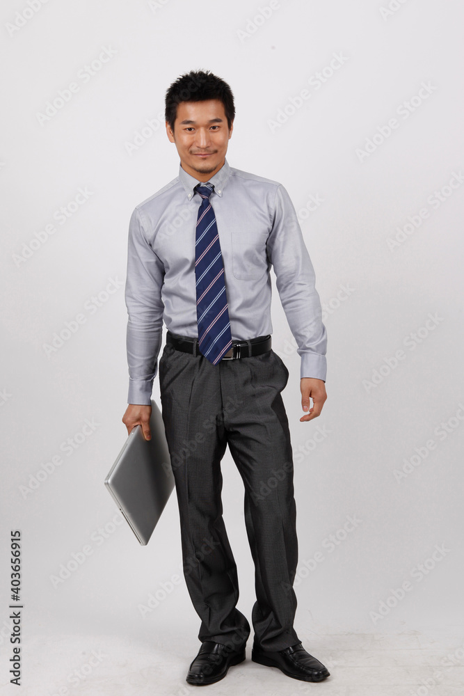 A young business man using a laptop