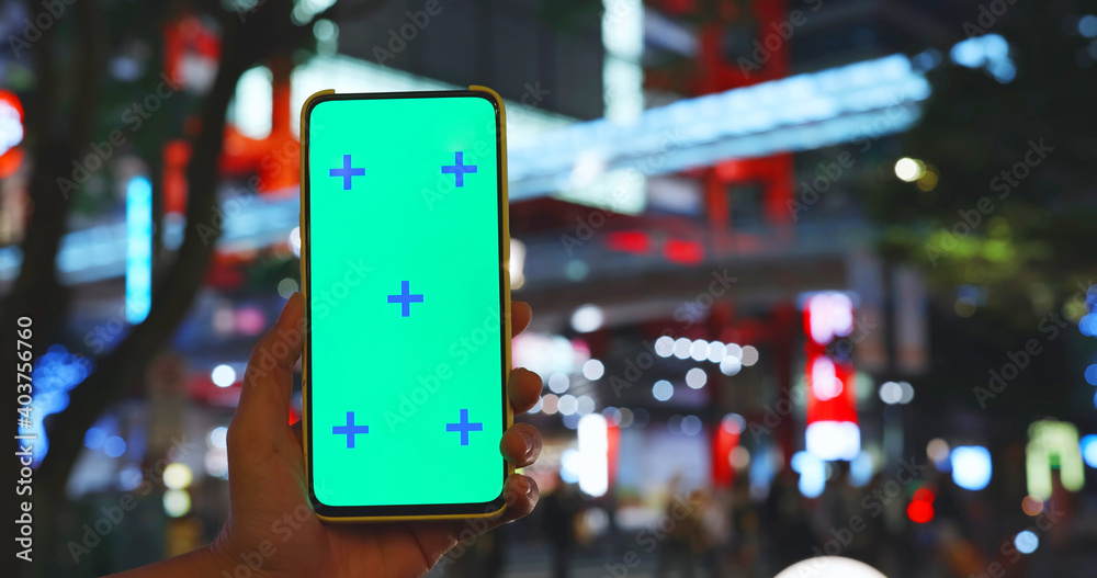 green screen smartphone near mall