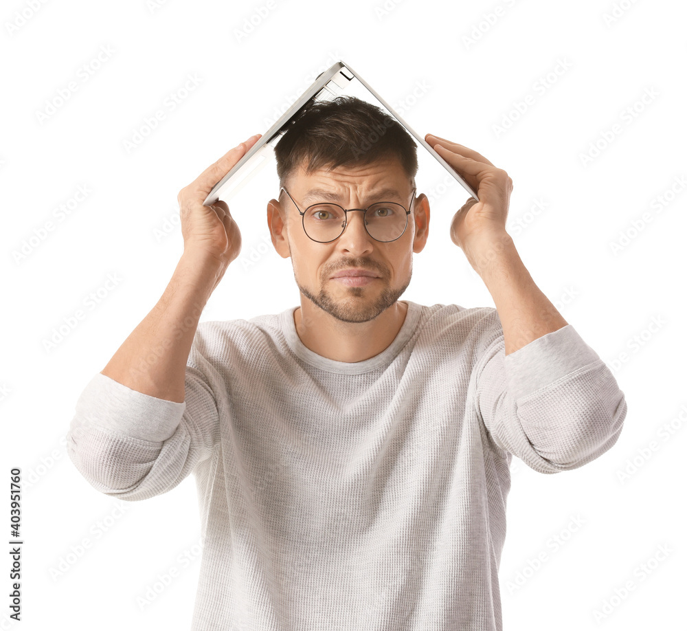 Stressed man with laptop on white background. Concept of deadline