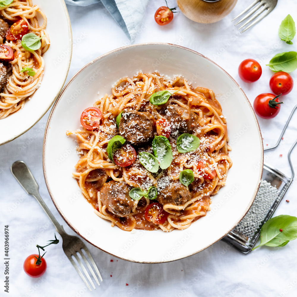 Spaghetti meatball topped with parmesan and basil food photography