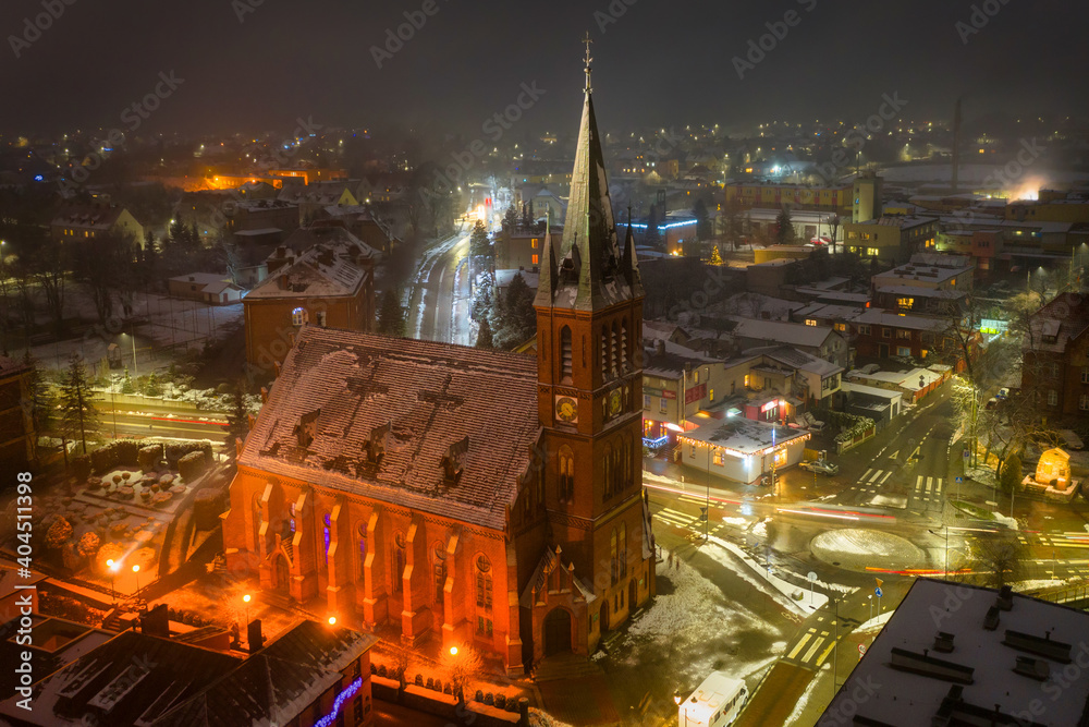 Aerial view of the old town square in Koscierzyna city by night, Poland