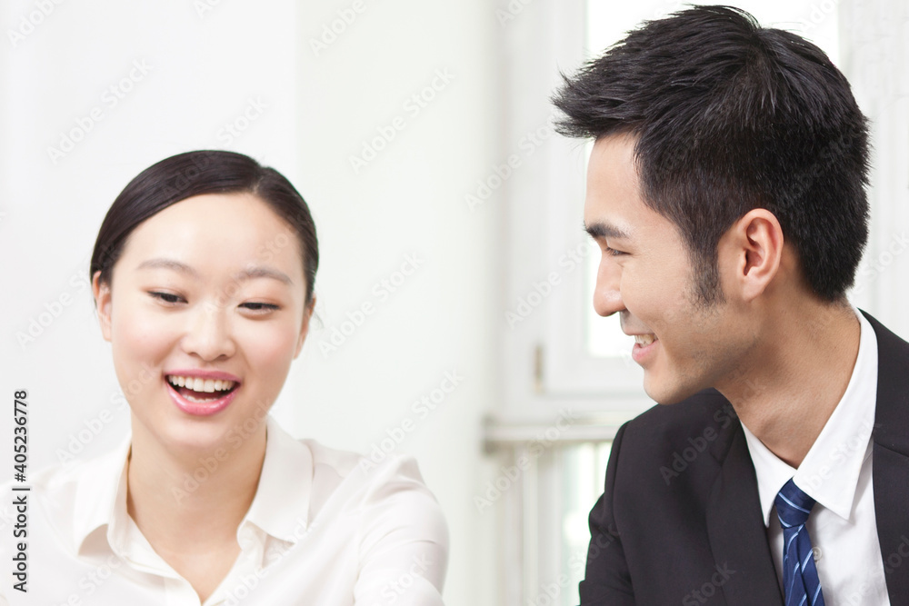 Business man and business woman discussing in office