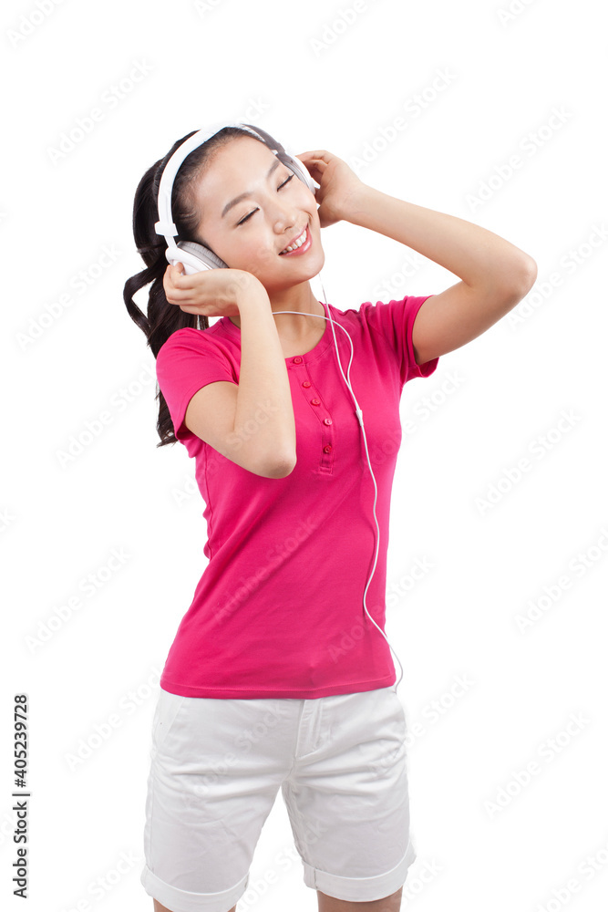 Young woman listening to music with headphones