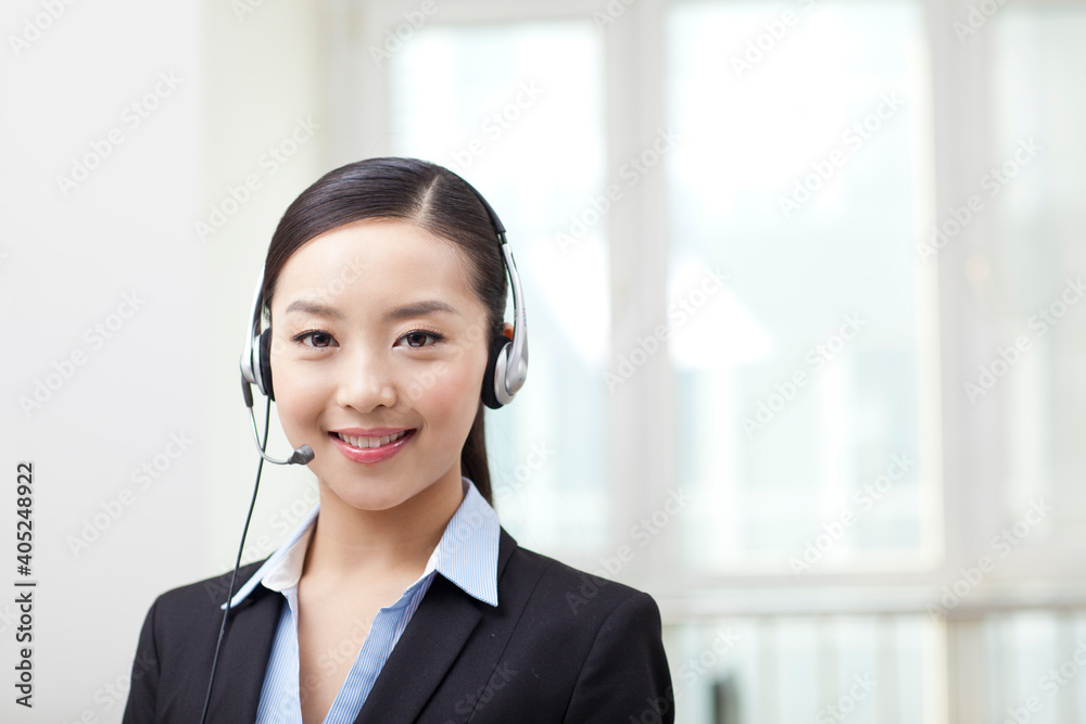 Young Female office worker wearing headset portrait