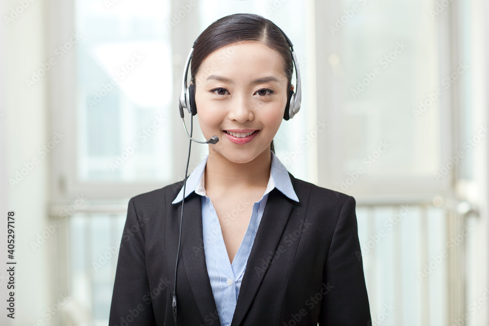 Young Female office worker wearing headset portrait