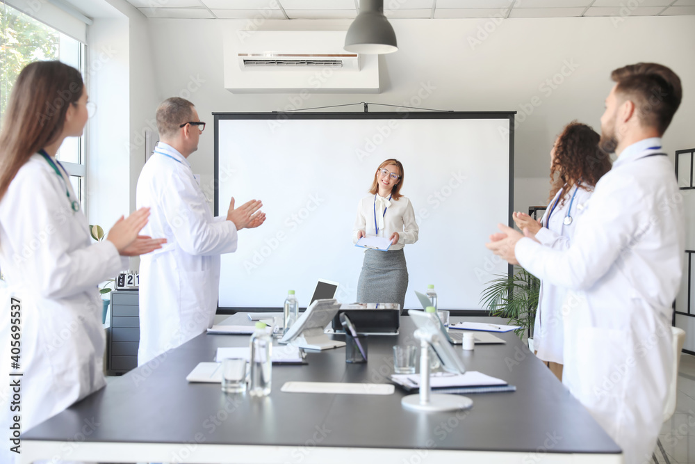 Team of doctors during meeting in modern clinic