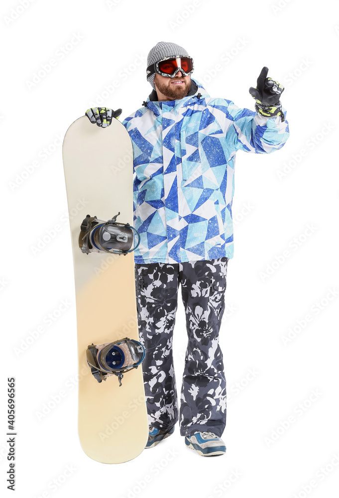 Male snowboarder pointing at something on white background