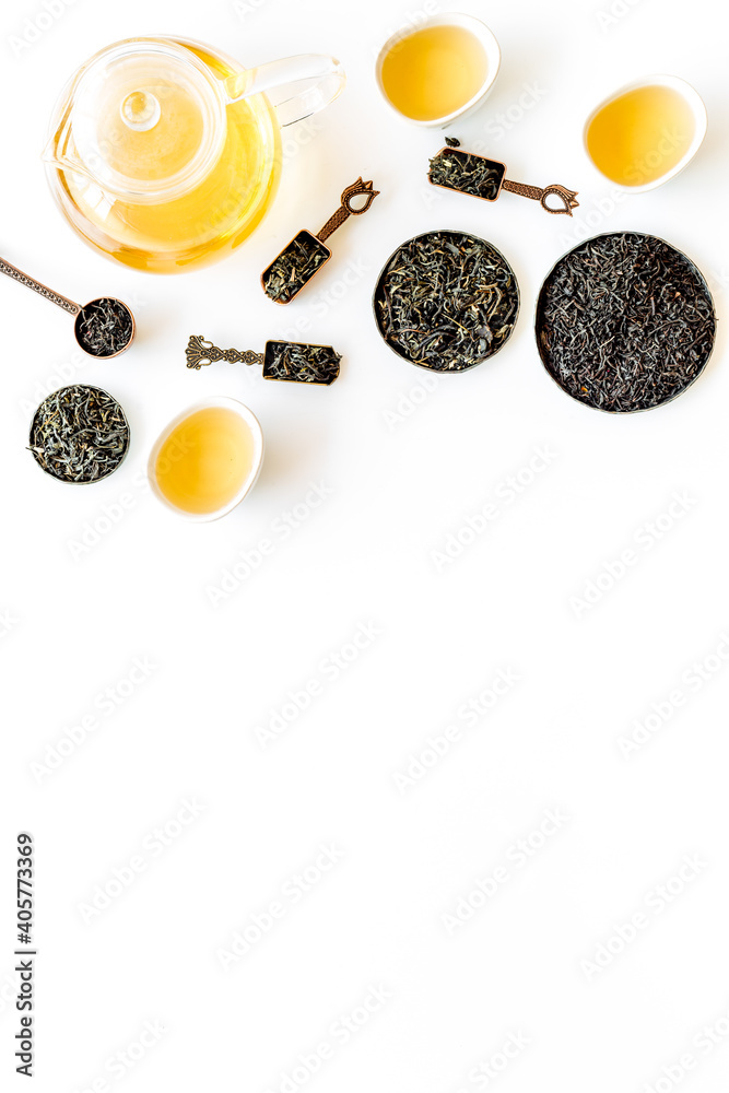 Top view of various tea in iron bowls and spoons. Asian tea ceremony