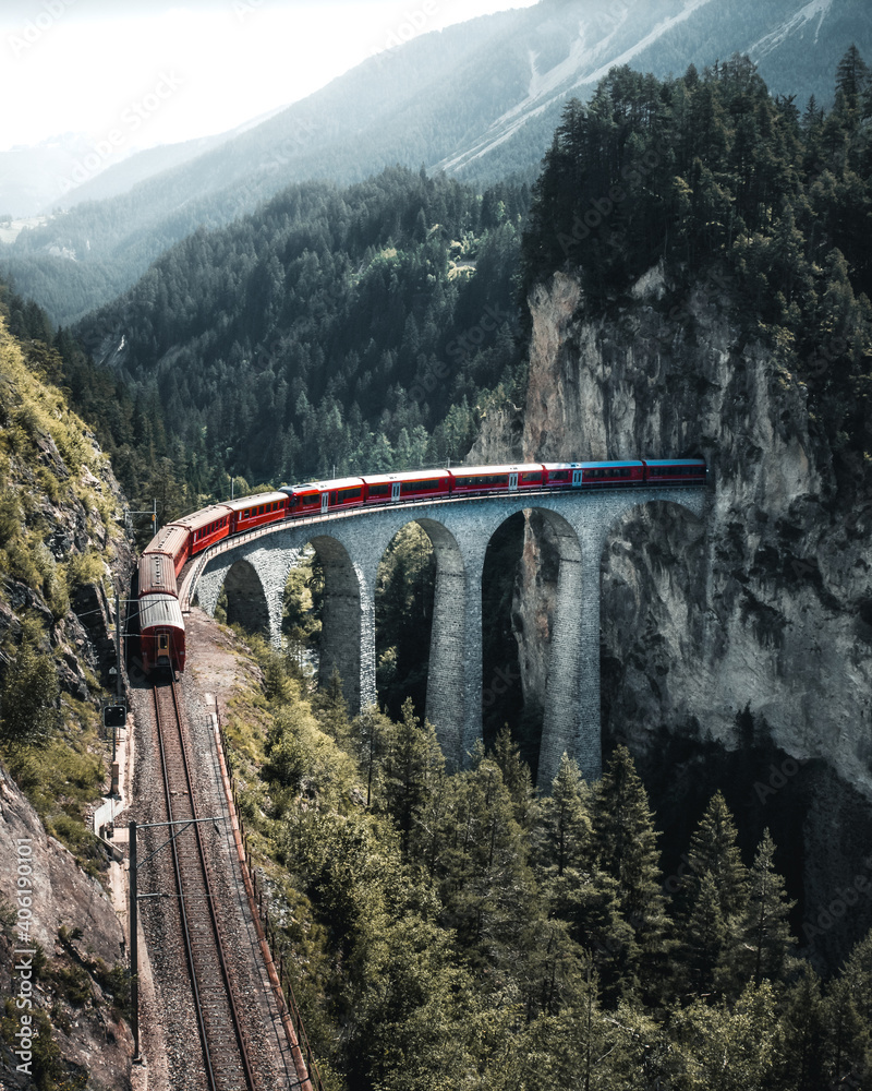 Swiss train ridin over the Landwasser Viaduct near Filisur, Canton of Grisons, Switzerland