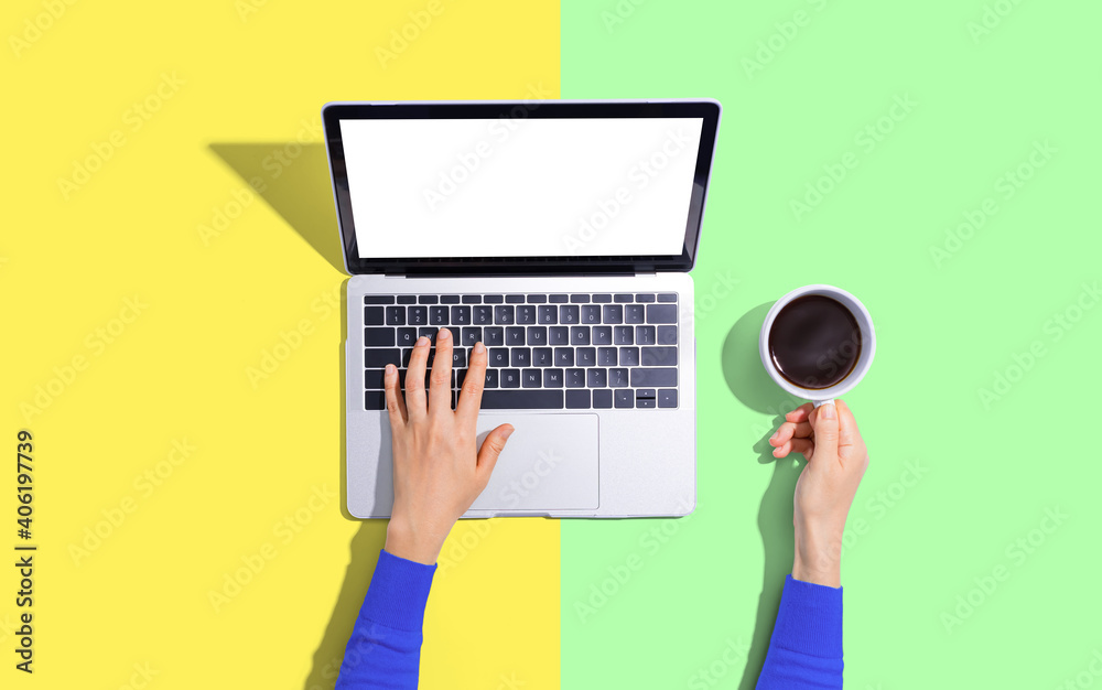 Person using a laptop computer from above