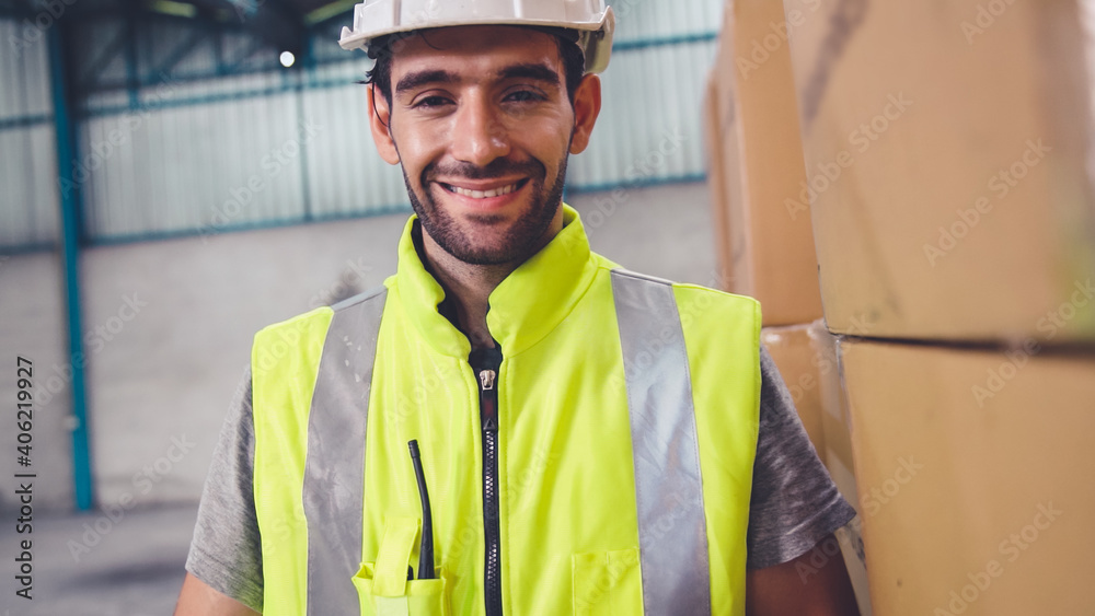 Professional industry worker close up portrait in the factory or warehouse . Production line operato