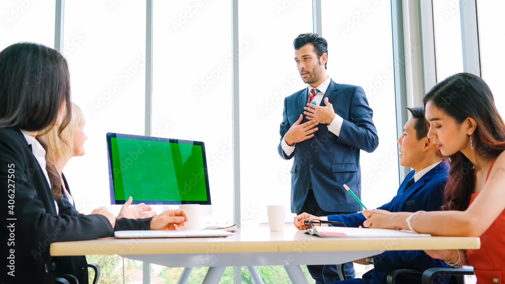 Business people in the conference room with green screen chroma key TV or computer on the office tab