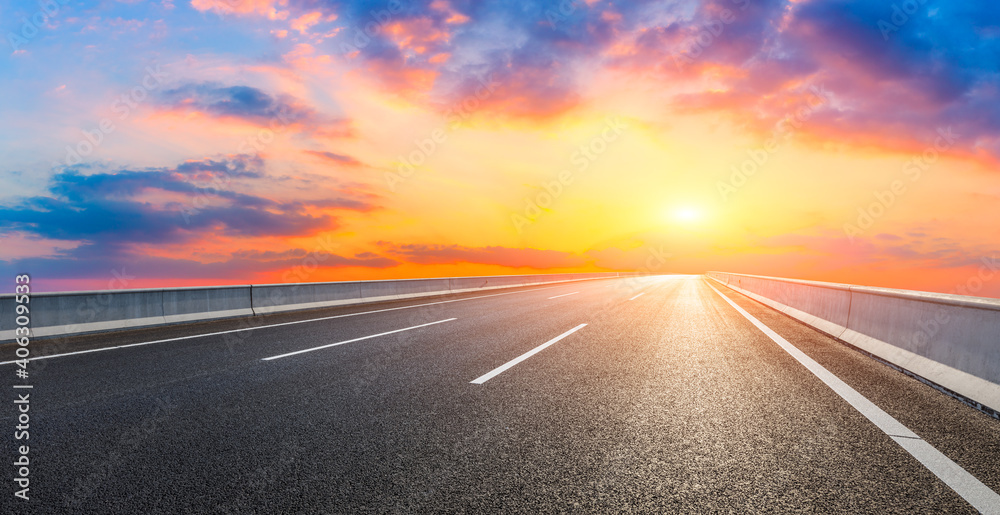 Asphalt road and sky clouds at sunset.Road background.