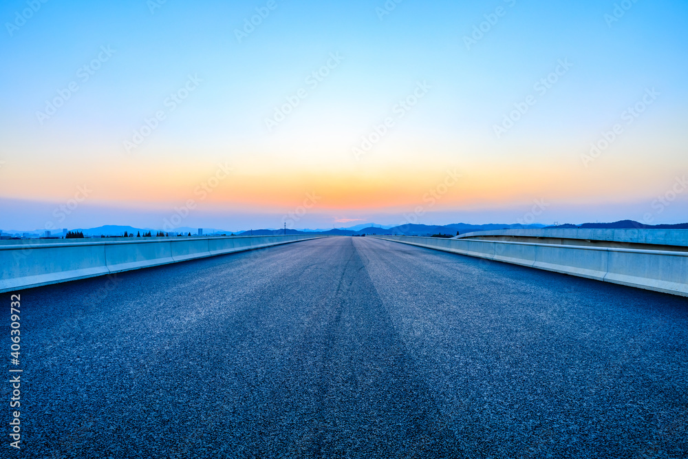 Asphalt road and sky at sunset.Road background.