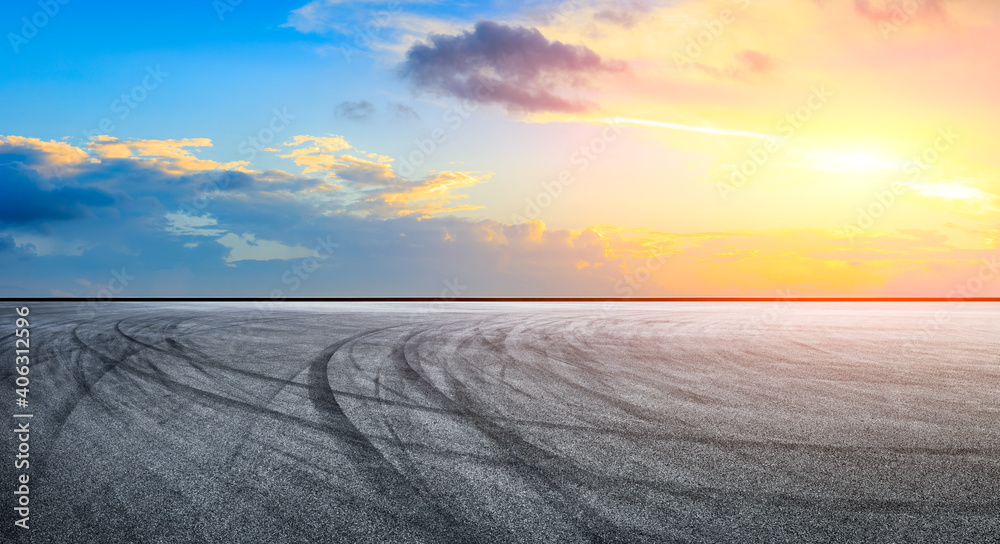 Asphalt race track road and sky clouds at sunset.Road ground background.